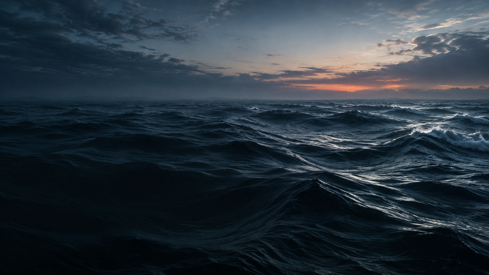 Dark Pacific swells beneath a quiet blue-hour horizon